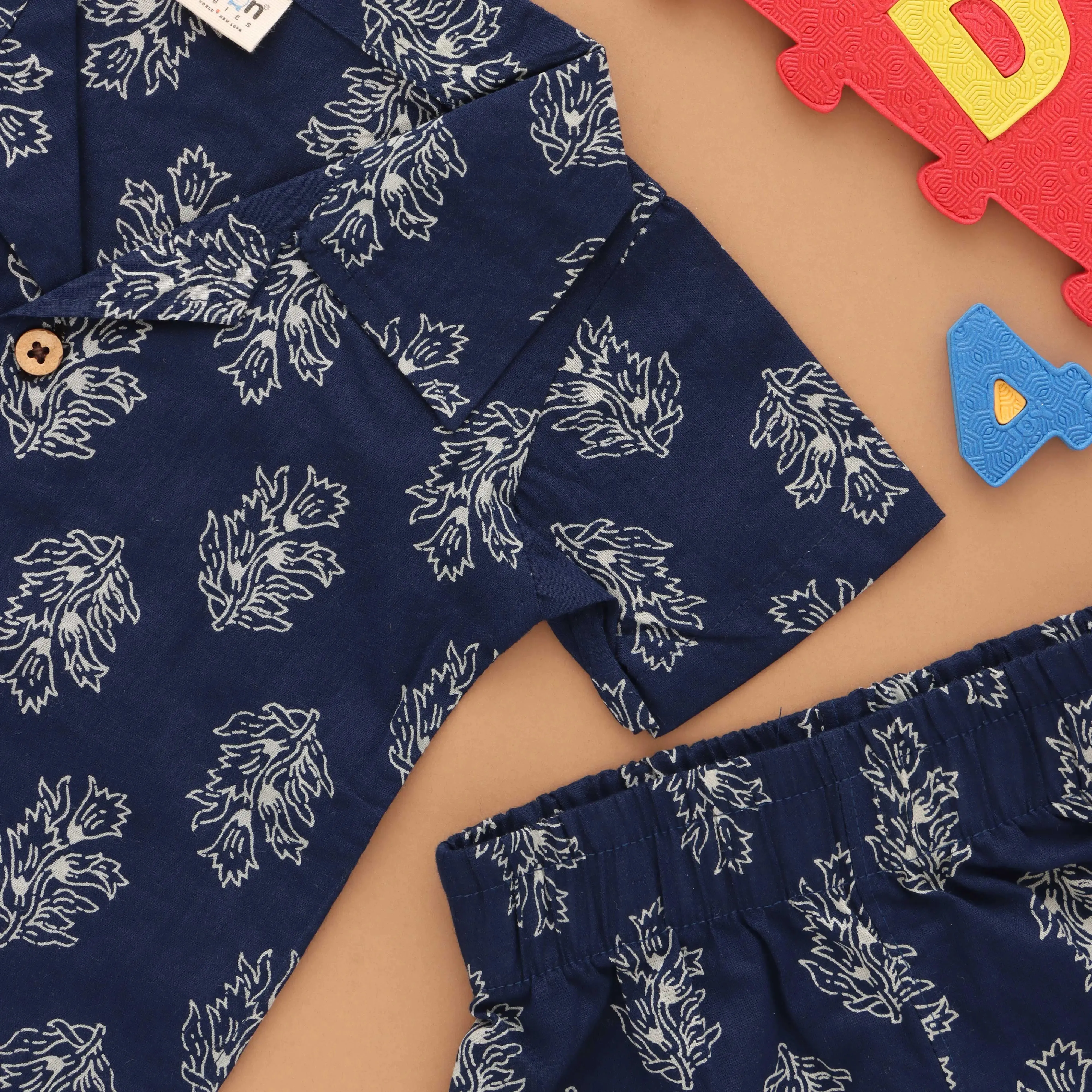 Floral Fiesta: Trendy Boys' Shirt and Shorts with Flower Prints